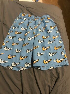 Nike Blue Swim Shorts with White and Orange Novelty Swoosh Faces